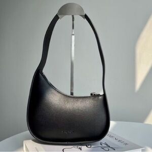 The Row Black Shoulder Bag Sleek Everyday Essential